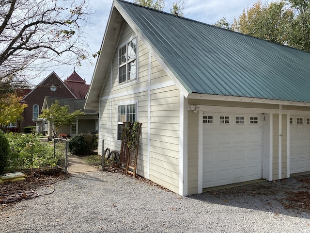 view of property exterior with a garage