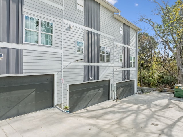 view of side of property with a garage