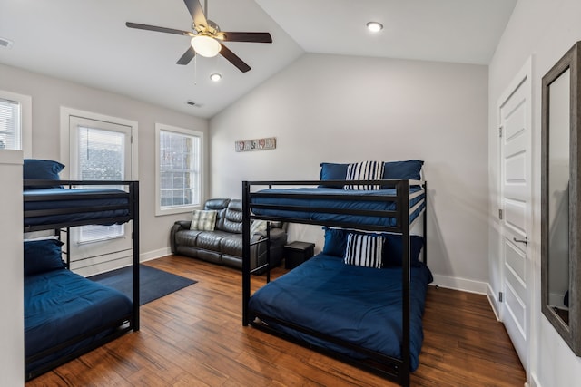 bedroom with lofted ceiling, dark hardwood / wood-style floors, and ceiling fan