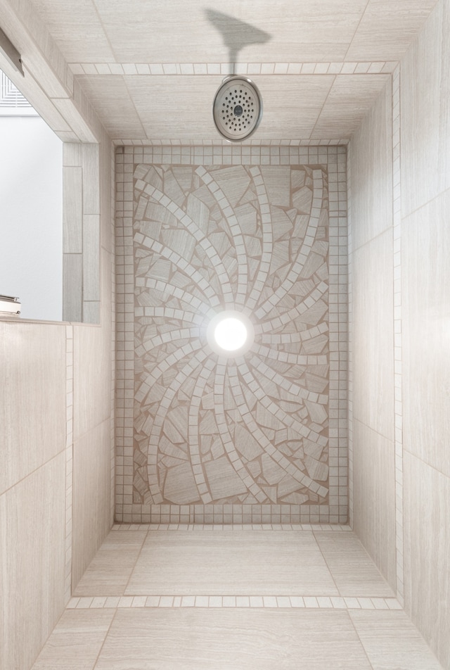 bathroom with tile patterned floors and a shower