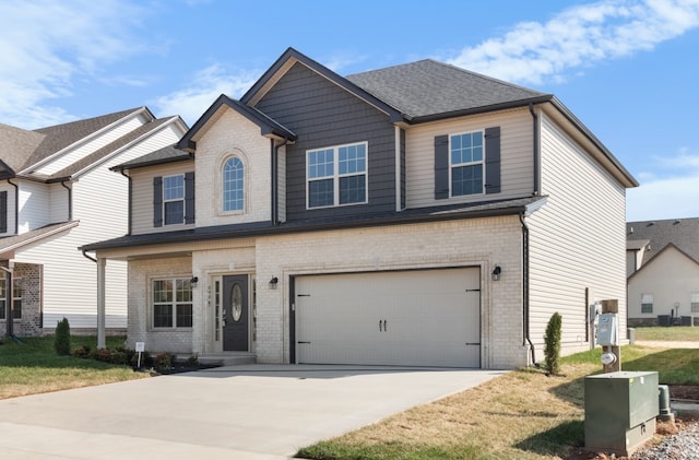 view of front of home with a garage and a front lawn