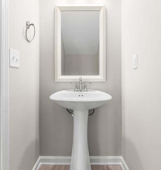 bathroom featuring hardwood / wood-style floors and sink