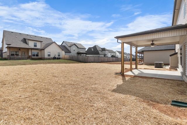 view of yard with central air condition unit, a patio area, and ceiling fan