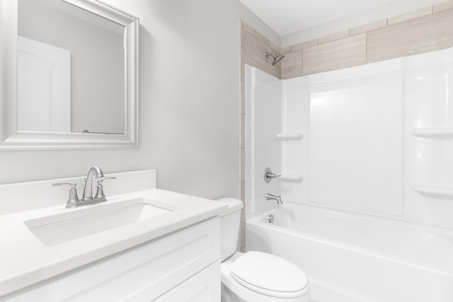 full bathroom with  shower combination, vanity, and toilet