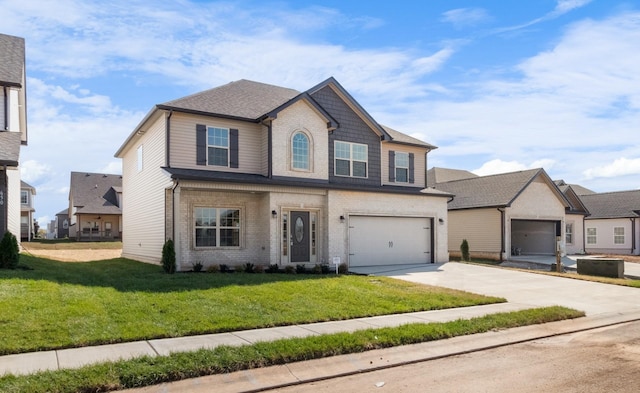 646 Woodrush Dr, Clarksville, TN 37040 - view of front of home with concrete driveway, a front lawn, brick siding, and an attached garage