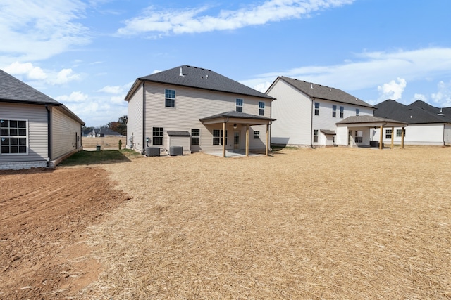 rear view of property featuring a patio area