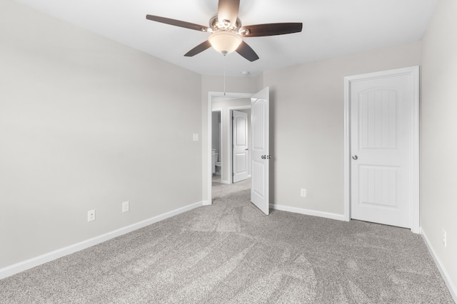 unfurnished bedroom with carpet flooring and ceiling fan