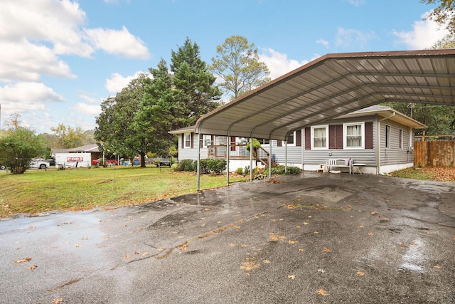 view of parking / parking lot with a carport and a lawn