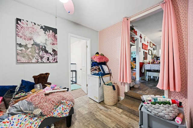 bedroom with hardwood / wood-style flooring and ceiling fan