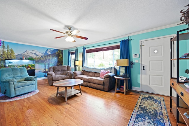 living room with a textured ceiling, light wood-type flooring, and ceiling fan