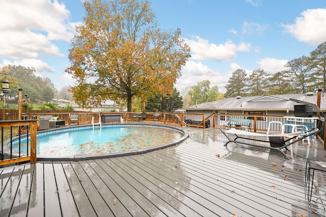 view of pool with a wooden deck