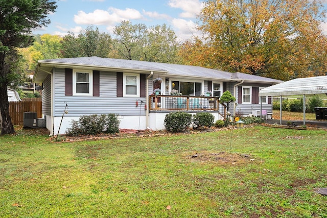 single story home featuring a wooden deck, cooling unit, a front lawn, and a carport