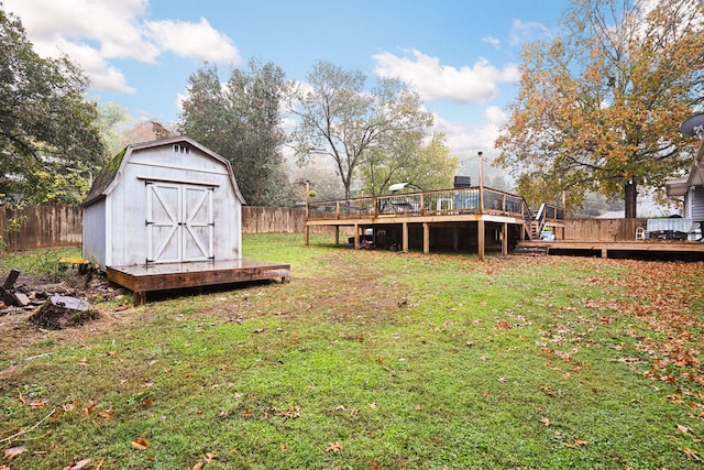 view of yard with a storage unit and a wooden deck