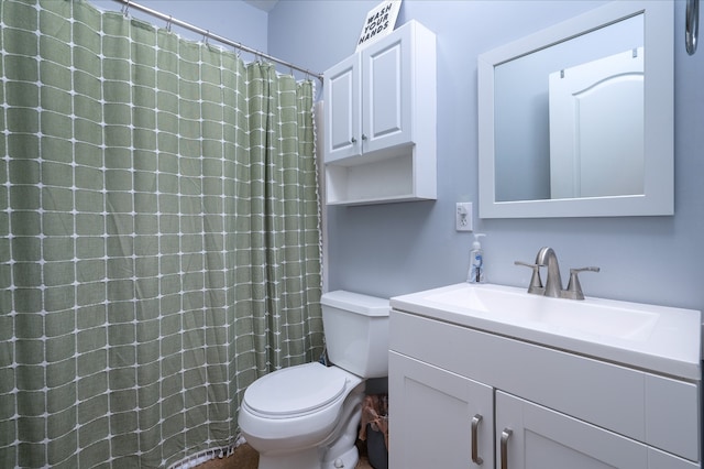 bathroom featuring toilet and vanity