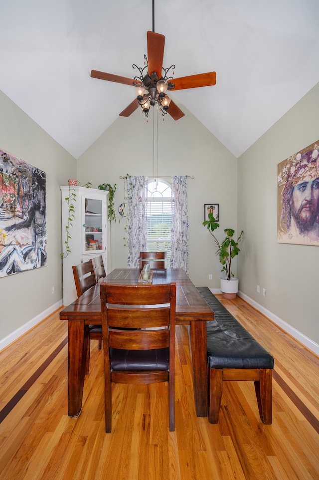 dining area featuring lofted ceiling, light wood-type flooring, and ceiling fan