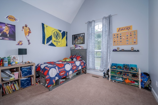 carpeted bedroom with vaulted ceiling