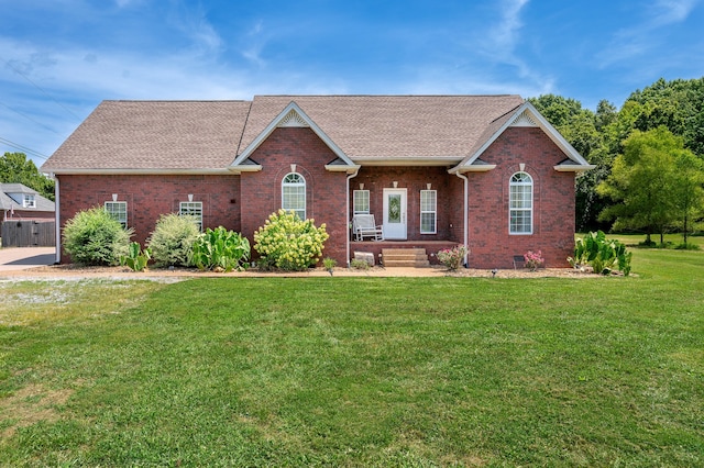 ranch-style house featuring a front lawn