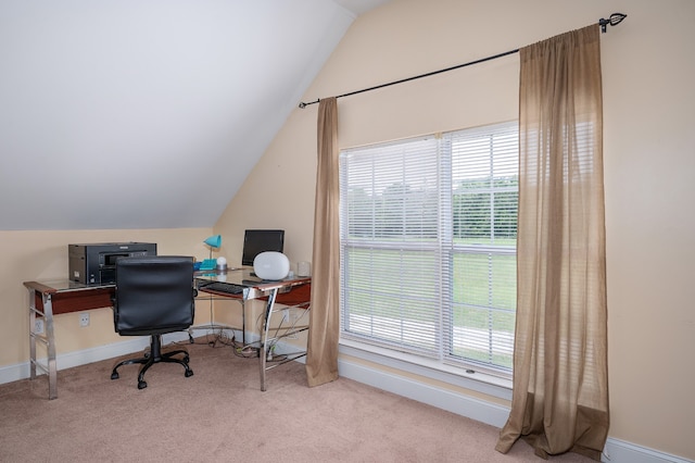 carpeted office featuring vaulted ceiling and plenty of natural light