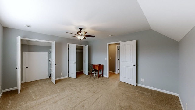 unfurnished bedroom featuring ceiling fan, light carpet, and lofted ceiling