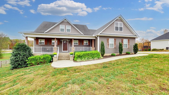 craftsman-style house featuring a front yard and a porch