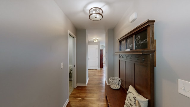 corridor featuring hardwood / wood-style floors