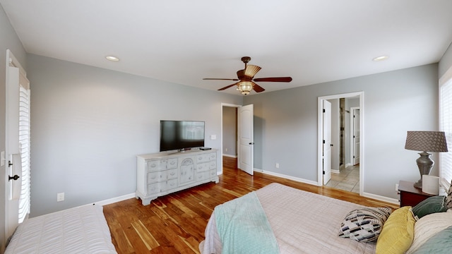 bedroom featuring light hardwood / wood-style flooring and ceiling fan