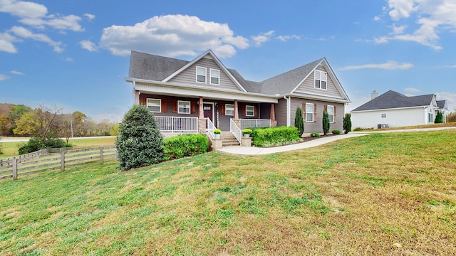 craftsman inspired home with a porch and a front lawn