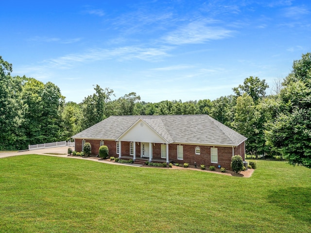 single story home featuring a front yard and covered porch