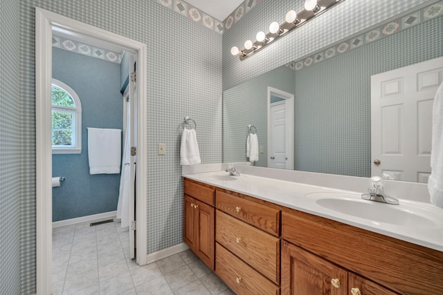 bathroom with vanity and tile patterned floors