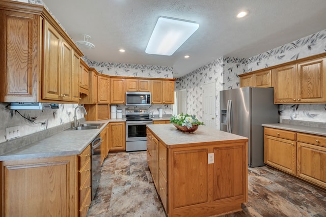 kitchen featuring a center island, decorative backsplash, stainless steel appliances, and sink