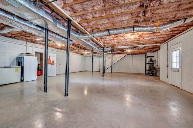 basement featuring white refrigerator