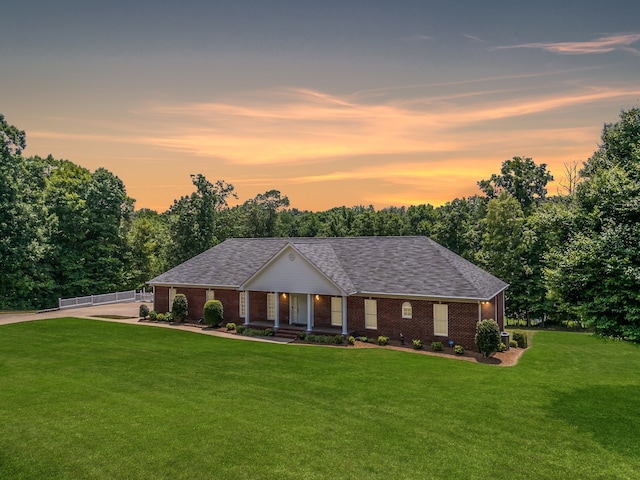 view of front of home with a lawn