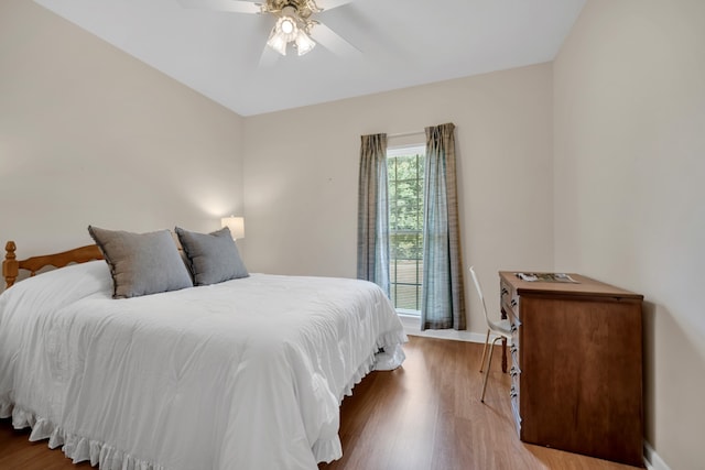 bedroom featuring hardwood / wood-style flooring and ceiling fan