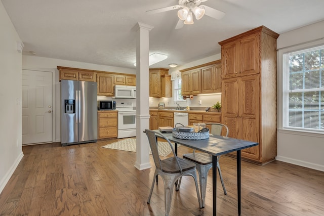 kitchen featuring light wood-type flooring, appliances with stainless steel finishes, sink, and plenty of natural light