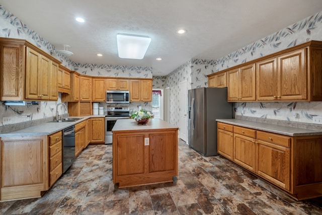 kitchen with sink, stainless steel appliances, tasteful backsplash, and a center island