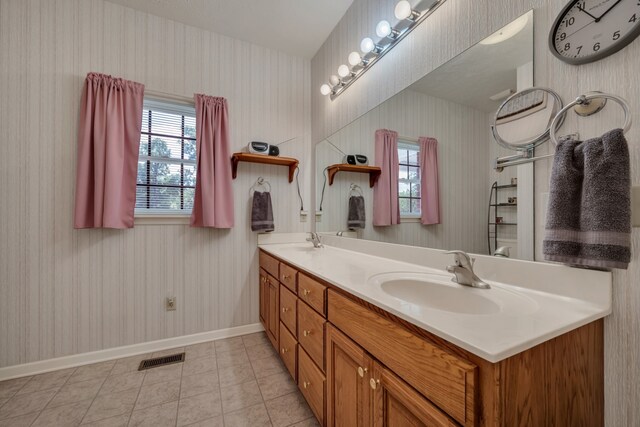 bathroom with vanity and tile patterned flooring