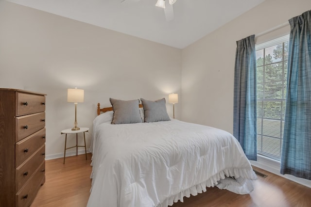 bedroom featuring light hardwood / wood-style flooring and ceiling fan