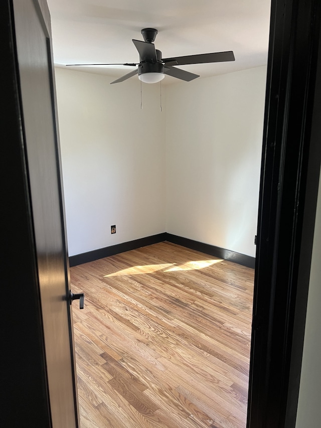 spare room with ceiling fan and light hardwood / wood-style flooring