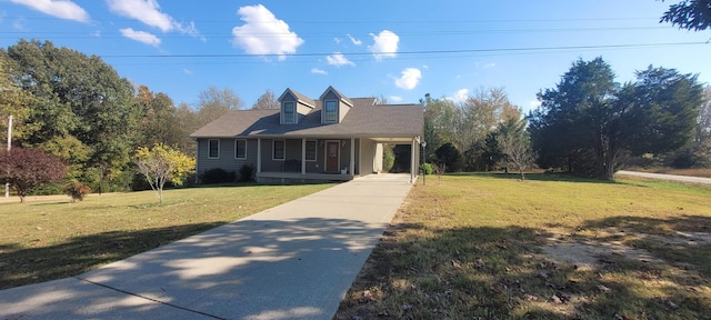 104 Oak Crest Dr, Tennessee Ridge, TN 37178 - cape cod house with a porch, driveway, a front yard, and a carport