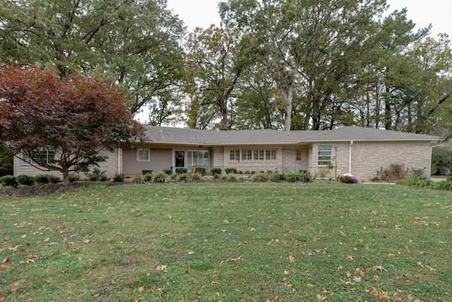 ranch-style house with a front lawn