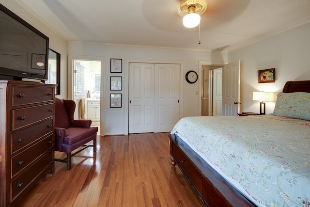 bedroom with wood-type flooring, ensuite bath, ceiling fan, and ornamental molding