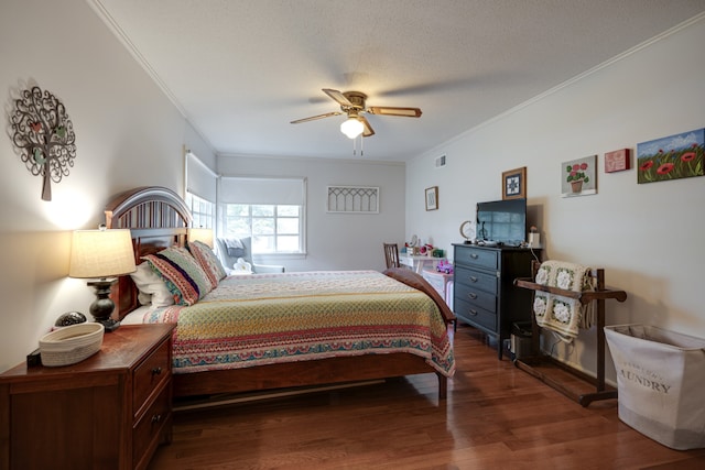 bedroom with a textured ceiling, ceiling fan, ornamental molding, and dark wood-type flooring