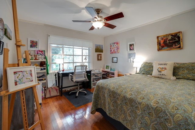 bedroom with ceiling fan, wood-type flooring, and ornamental molding