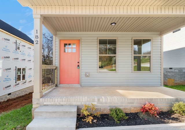 doorway to property featuring a porch