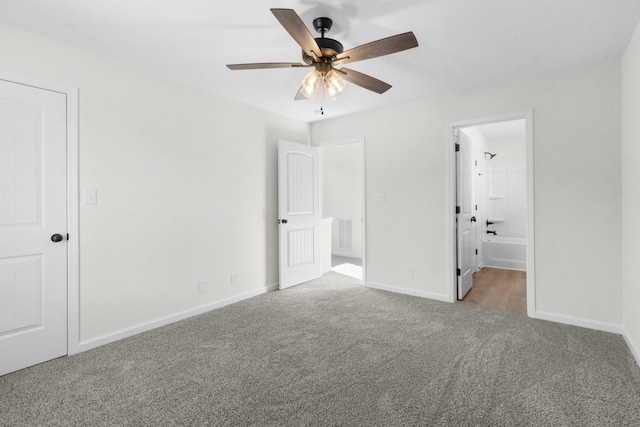 unfurnished bedroom featuring connected bathroom, ceiling fan, and carpet floors