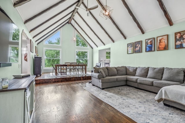 living room with dark wood-type flooring, beam ceiling, and high vaulted ceiling