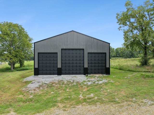 garage with a yard