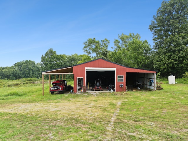 view of outdoor structure featuring a yard and a carport