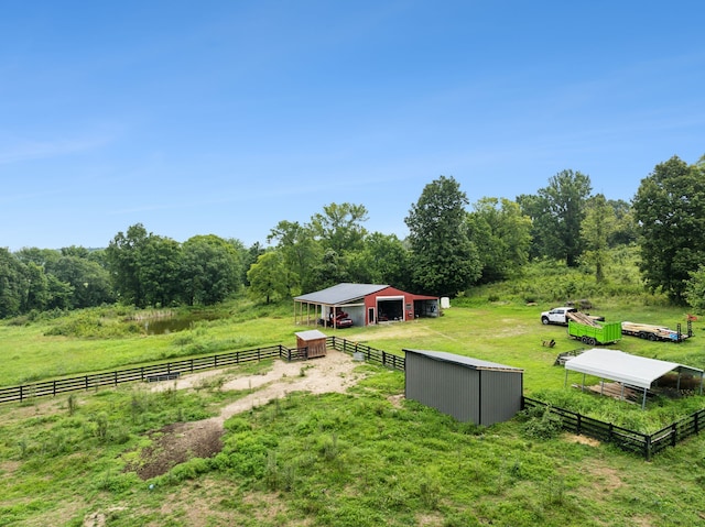 exterior space with a rural view and an outdoor structure