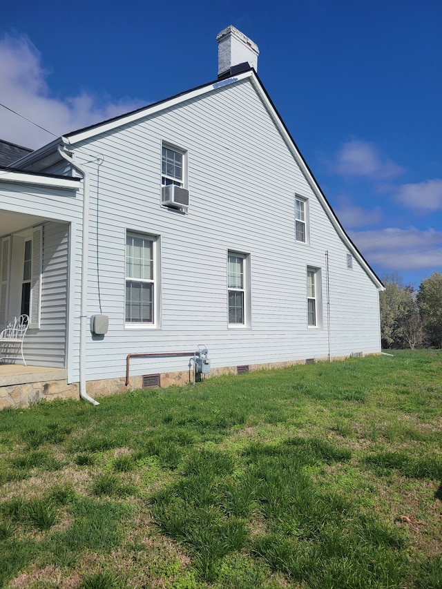 view of property exterior with a lawn